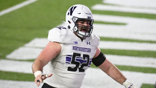 Northwestern Wildcats offensive lineman Sam Gerak (52) celebrates a Wildcats touchdown during the third quarter against the Michigan State Spartans at Spartan Stadium. Tim Fuller-USA TODAY Sports